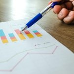 A person typing on a laptop represents a modern work or study environment