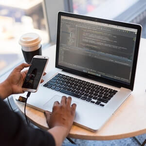 a laptop computer sitting on top of a table