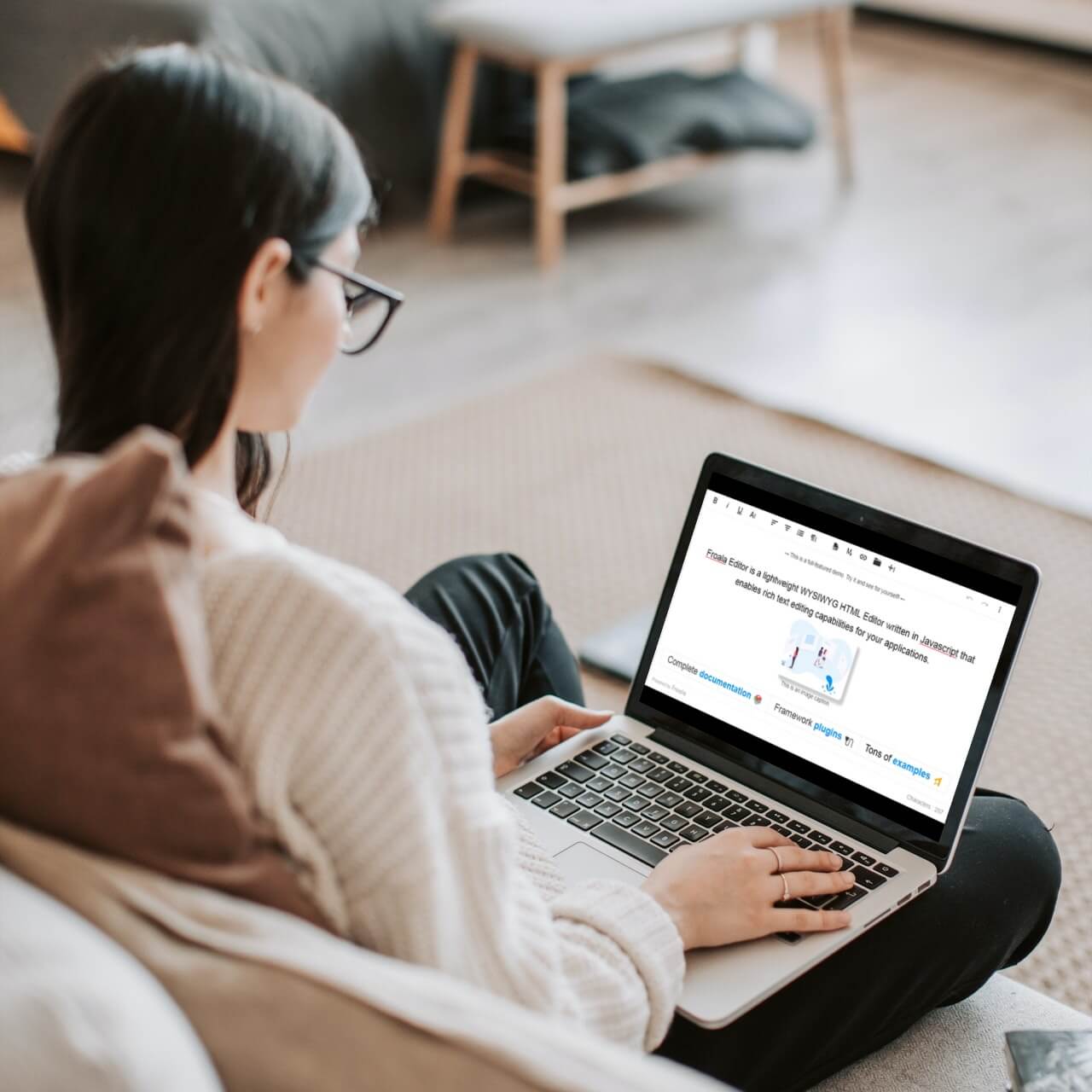 a person sitting in front of a laptop