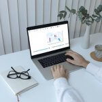 a laptop computer sitting on top of a table